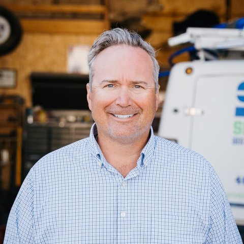 Henry Fence Co. employee Dustin smiling in a headshot photo.